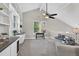 Bright, lofted living room with vaulted ceilings, built-in shelving, and natural light at 11245 San Joaquin Rdg, Littleton, CO 80127