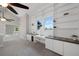 Bright loft featuring custom built-in shelves, offering ample storage and display space at 11245 San Joaquin Rdg, Littleton, CO 80127
