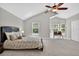 Bright main bedroom with lots of windows, soft carpeting, and walk-in closet at 11245 San Joaquin Rdg, Littleton, CO 80127