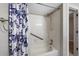 Bathroom shower with a blue floral curtain and white tiles at 11245 San Joaquin Rdg, Littleton, CO 80127