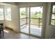 Balcony area with a view overlooking greenery, accessible through sliding glass doors at 17361 E Mansfield Ave # 521R, Aurora, CO 80013
