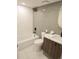 Bathroom with tiled walls, a modern vanity, and updated fixtures at 17361 E Mansfield Ave # 521R, Aurora, CO 80013