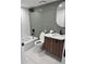Modern bathroom with updated fixtures, tiled walls, and a combined shower and tub at 17361 E Mansfield Ave # 521R, Aurora, CO 80013