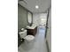 Bathroom with stylish gray tile and a modern vanity at 17361 E Mansfield Ave # 521R, Aurora, CO 80013