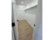 Empty closet with wood-look flooring and shelving at 17361 E Mansfield Ave # 521R, Aurora, CO 80013