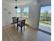 Cozy dining area with bright natural light, modern flooring, and access to the balcony at 17361 E Mansfield Ave # 521R, Aurora, CO 80013