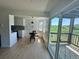 Bright dining area open to the kitchen, with sliding glass doors leading to a balcony at 17361 E Mansfield Ave # 521R, Aurora, CO 80013