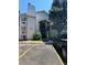 Exterior view of a well-maintained apartment building with visible unit numbers and parking at 17361 E Mansfield Ave # 521R, Aurora, CO 80013