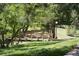 Charming wooden bridge surrounded by lush greenery and mature trees, creating a tranquil retreat at 17361 E Mansfield Ave # 521R, Aurora, CO 80013