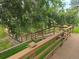 Wooden stairs and walkway are nestled among lush green trees, offering a tranquil outdoor experience at 17361 E Mansfield Ave # 521R, Aurora, CO 80013