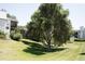 A sprawling green yard is complemented by mature trees and manicured landscaping, creating an inviting outdoor space at 17361 E Mansfield Ave # 521R, Aurora, CO 80013