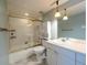 Bathroom with shower/tub combo and double vanity at 550 E 12Th Ave # 1501, Denver, CO 80203