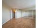 Spacious bedroom with mirrored closet and wood floors at 550 E 12Th Ave # 1501, Denver, CO 80203