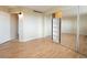 Bedroom with mirrored closet and built-in shelving at 550 E 12Th Ave # 1501, Denver, CO 80203