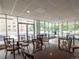 Bright community room with tables and chairs overlooking the pool at 550 E 12Th Ave # 1501, Denver, CO 80203