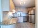 Kitchen with granite countertops and stainless steel appliances at 550 E 12Th Ave # 1501, Denver, CO 80203