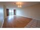 Spacious living room with hardwood floors and access to a balcony at 550 E 12Th Ave # 1501, Denver, CO 80203