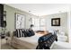 Stylish bedroom featuring a black and white design, decorative lighting, and a cozy window nook at 24360 E Glasgow Dr, Aurora, CO 80016