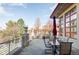 Expansive outdoor deck with patio furniture, urns and railing, great for entertaining at 24360 E Glasgow Dr, Aurora, CO 80016