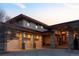 View of the front of this home featuring a large, multi-car garage at 24360 E Glasgow Dr, Aurora, CO 80016