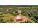 Aerial view highlighting the property's layout, with outbuildings, ample land, and beautiful surroundings at 1380 Oak Valley Rd, Sedalia, CO 80135