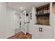 Finished basement bar with wooden countertop and stone backsplash at 1380 Oak Valley Rd, Sedalia, CO 80135