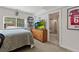 Comfortable bedroom showcasing a connecting bathroom and a well-lit, welcoming space at 1380 Oak Valley Rd, Sedalia, CO 80135