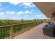 Expansive deck overlooking beautiful countryside views with comfortable seating and a charming railing at 1380 Oak Valley Rd, Sedalia, CO 80135