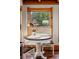 Charming dining nook with views of the outside yard and landscaping at 1380 Oak Valley Rd, Sedalia, CO 80135
