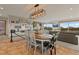 Inviting dining area near the living room with large windows and natural light at 1380 Oak Valley Rd, Sedalia, CO 80135