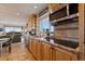 Bright kitchen with stainless steel appliances and beautiful cabinetry and views to the outside at 1380 Oak Valley Rd, Sedalia, CO 80135