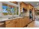Bright kitchen with views from the window, including updated countertops and appliances at 1380 Oak Valley Rd, Sedalia, CO 80135
