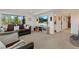 Cozy living room with plush seating, large windows overlooking nature, and an entertainment center with a TV at 1380 Oak Valley Rd, Sedalia, CO 80135