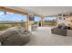 Bright and spacious living room boasts oversized windows with scenic outdoor views and comfortable seating at 1380 Oak Valley Rd, Sedalia, CO 80135