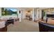 Spacious living room featuring carpeted floors, a stone fireplace, a TV, and comfortable seating at 1380 Oak Valley Rd, Sedalia, CO 80135