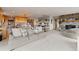 Open-concept living area showcasing the kitchen, dining space, and a cozy fireplace at 1380 Oak Valley Rd, Sedalia, CO 80135