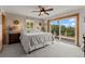 Serene main bedroom with a sliding glass door to the deck, providing access to outdoor views at 1380 Oak Valley Rd, Sedalia, CO 80135