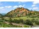 Scenic mountain view, with trees in the foreground and the sky partly cloudy at 1380 Oak Valley Rd, Sedalia, CO 80135