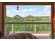 Breathtaking view of the surrounding hills from the window, bringing nature into the home at 1380 Oak Valley Rd, Sedalia, CO 80135