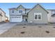 Inviting two-story home with a two-car garage, neat landscaping and charming architectural details at 39886 Floyd St, Elizabeth, CO 80107