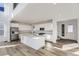 Modern kitchen featuring a large central island, stainless appliances and white cabinets at 39886 Floyd St, Elizabeth, CO 80107