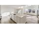 Beautiful kitchen island with a sink, seating, and stylish countertops, plus stainless appliances at 39886 Floyd St, Elizabeth, CO 80107