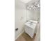 Clean bathroom with a vanity, toilet, and updated fixtures at 17054 E Tennessee Dr # 212, Aurora, CO 80017