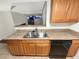 Kitchen boasts granite countertops, wood cabinets, and a double sink at 17054 E Tennessee Dr # 212, Aurora, CO 80017