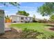 Expansive backyard with a well-kept lawn, patio area, grill, and secure fencing, ideal for entertaining at 9220 Yucca Way, Thornton, CO 80229