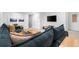 Finished basement area with comfortable seating, entertainment center, and modern decor at 9220 Yucca Way, Thornton, CO 80229