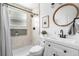 Stylish bathroom with modern vanity, walk-in shower, matte black hardware, and elegant finishes at 9220 Yucca Way, Thornton, CO 80229