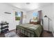 Cozy bedroom with two windows providing natural light and views of the outdoors at 9220 Yucca Way, Thornton, CO 80229
