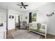 Bright Bedroom features a ceiling fan, natural light, wood floors, and a neutral-toned rug at 9220 Yucca Way, Thornton, CO 80229