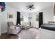 Comfortable Bedroom with rocking chair, crib, soft rug, and plenty of natural light at 9220 Yucca Way, Thornton, CO 80229